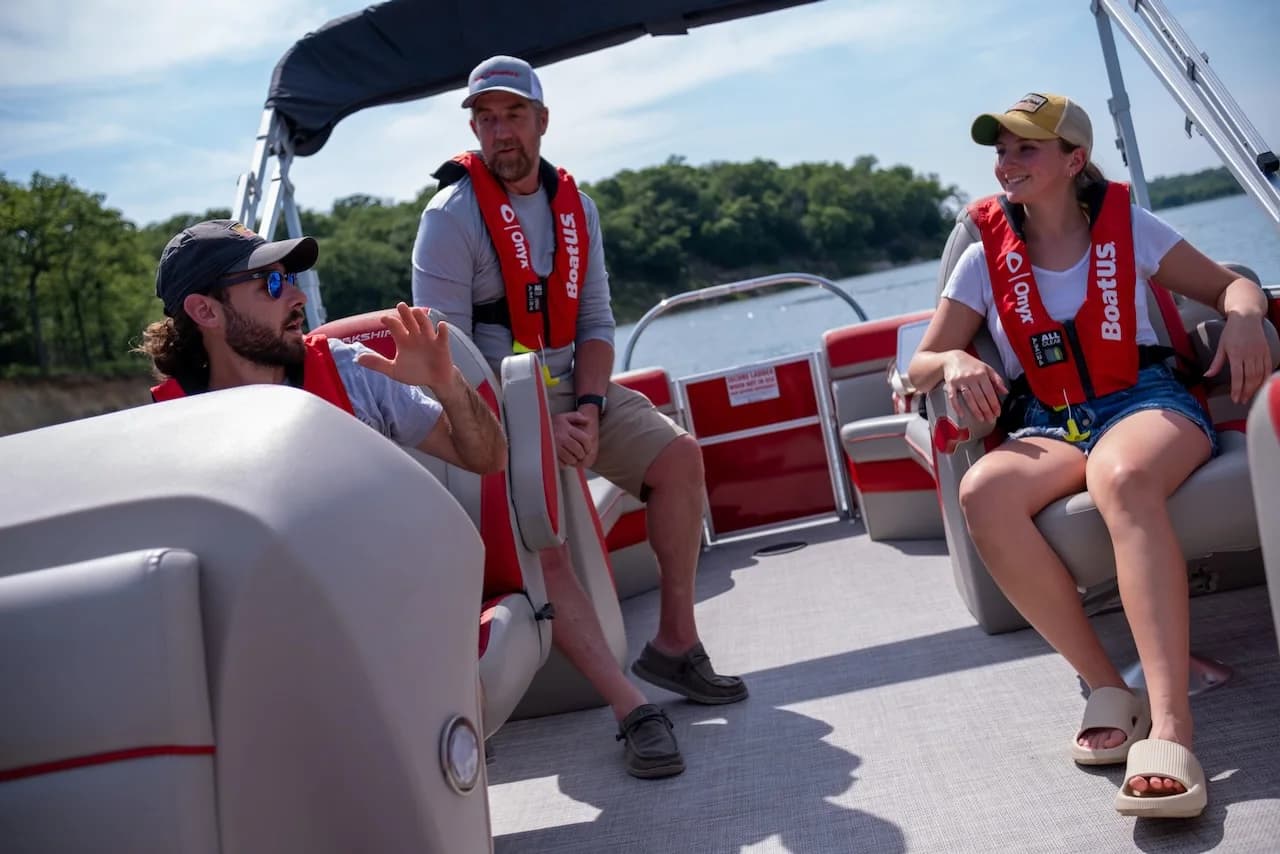 A captain and students discussing boat handling during a private lesson