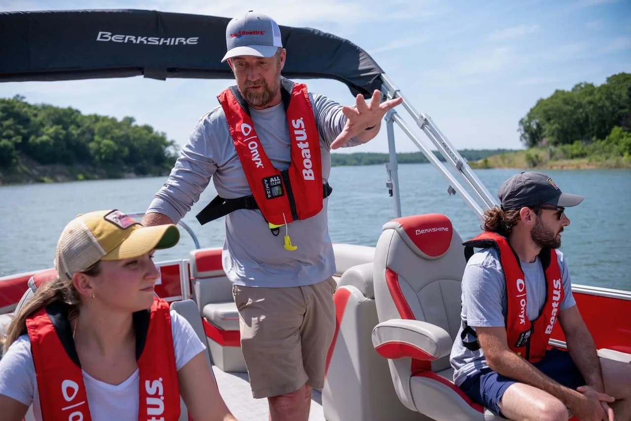 A BoaterWise captain coaching students aboard a pontoon on Lake Texoma